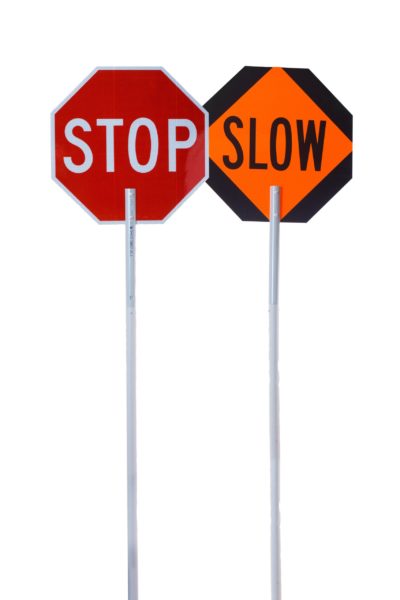 stop sign and slow sign on a staff for traffic flaggers
