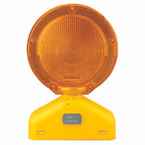 orange construction flashing light for baricades and drums