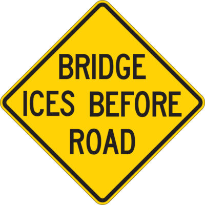 bridge ices before road diamond yellow sign