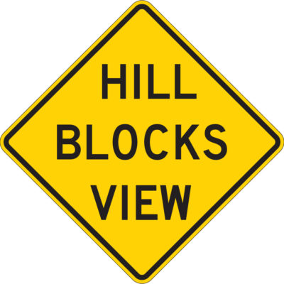 hill blocks view yellow diamond sign