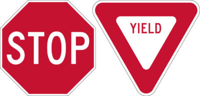 red and white stop yield signs