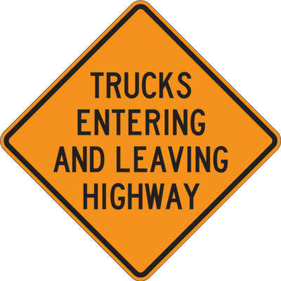 trucks entering and leaving highway orange sign diamond