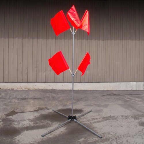 Galvanized steel flag tree stand with T-pin leg release system deployed in a work zone.