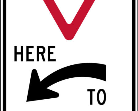 yield here to pedestrians left sign