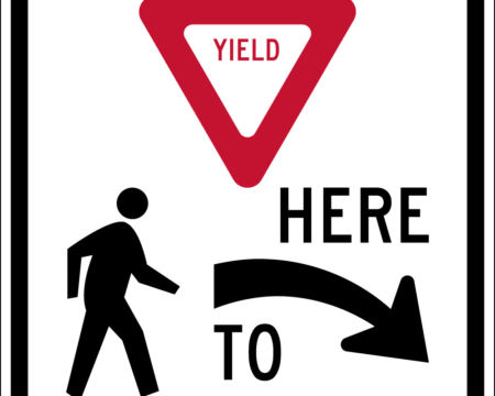 yield here to pedestrians right sign