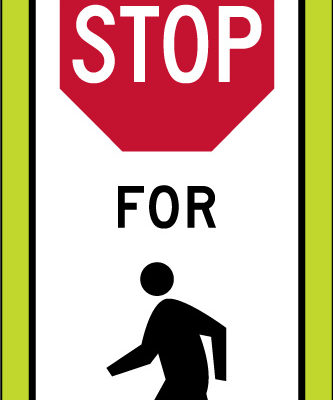 state law stop pedestrians crosswalk yellow panel sign