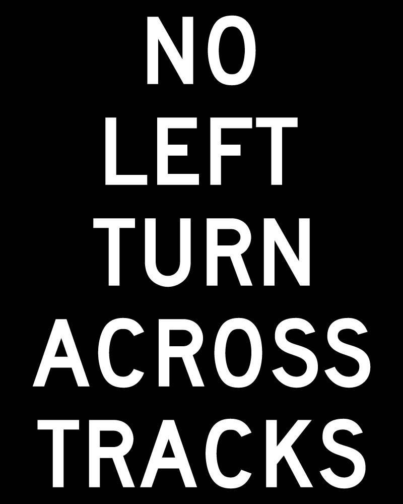 NO LEFT TURN ACROSS TRACKS