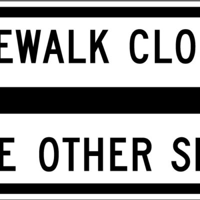 sidewalk closed use other side both side arrows white sign