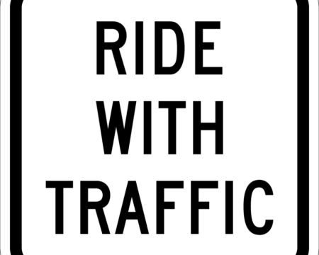 ride with traffic white sign