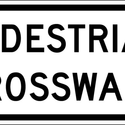 white pedestrian crosswalk sign