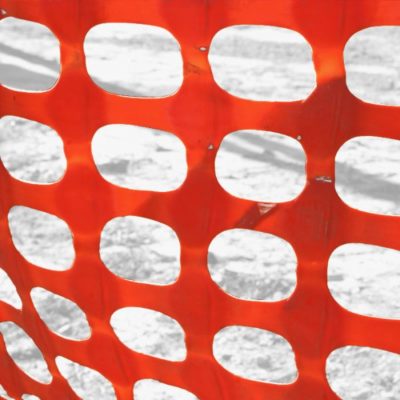 close up orange snow mesh fence