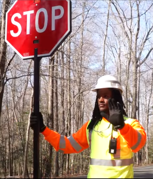 flagger paddle, stop slow paddle, crossing guard, traffic signs, hald held stop sign, led stop sign, lighted stop sign.
