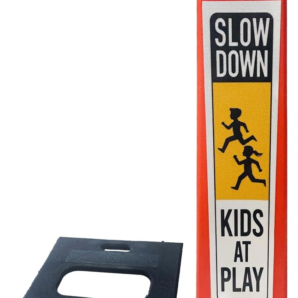 Kids at play street sign deployed on a residential street corner for neighborhood safety.