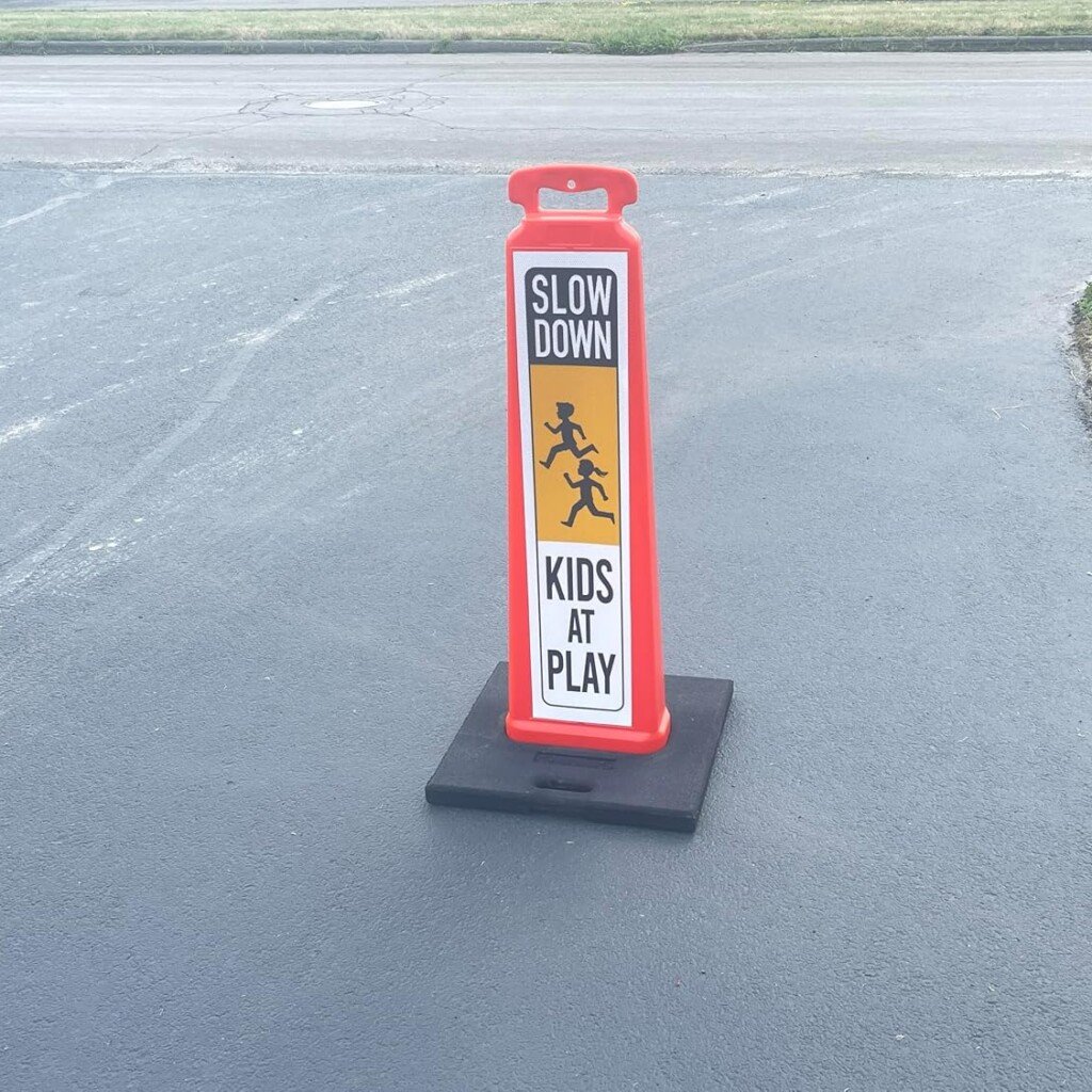 Commercial grade reflective kids at play street sign for apartment complex and parking lot wayfinding.
