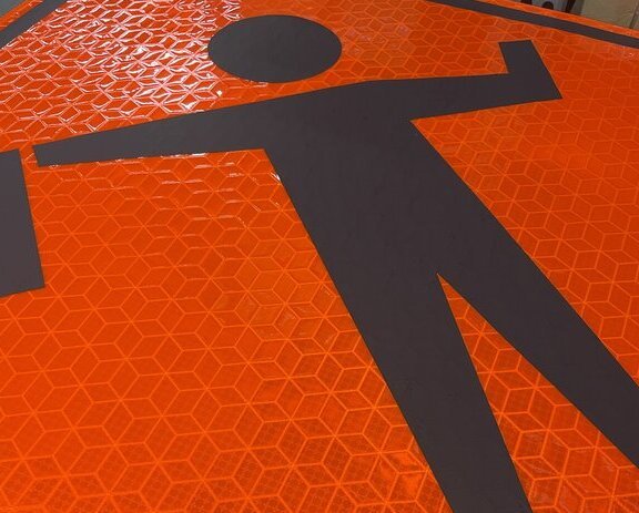 ORALITE Marathon Roll-Up Reflective Material displaying high visibility in a work zone